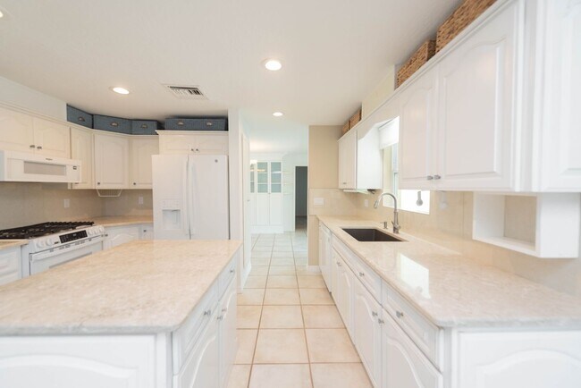 Building Photo - Live the ultimate Space Coast waterfront lifestyle at this stunning beachside canal home in Satel...