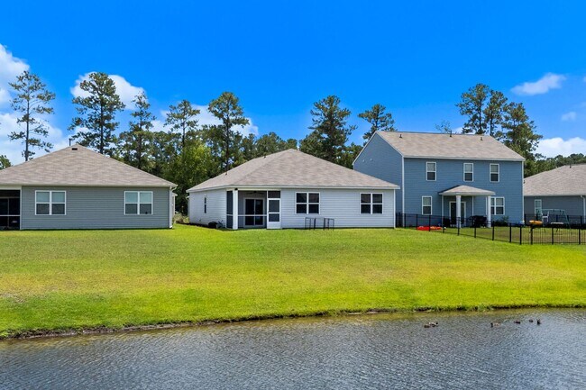 Building Photo - Modern 4BR Home with Screened Porch & Pond Views | Sun Colony, Longs SC