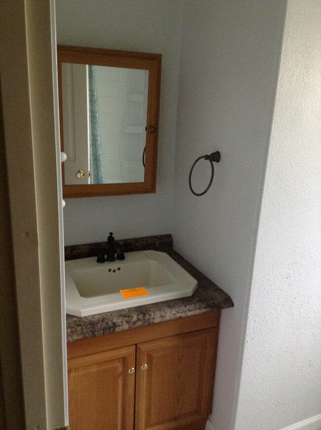 Bathroom is off the main hallway and between the master and second bedroom. - 24 N K St