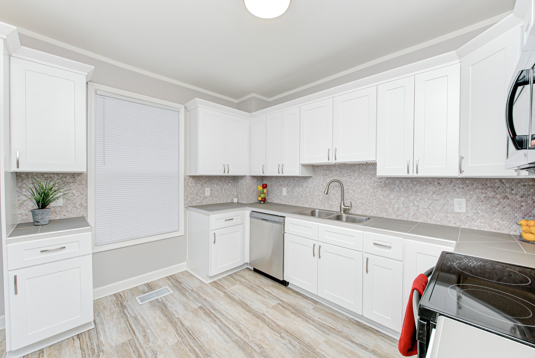Beautiful tile kitchen backsplash and dishwasher - 2418 E 16th St
