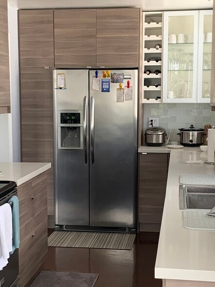 Kitchen with built-in pantry and refrigerator with filtered water and ice - 8530 Holloway Dr