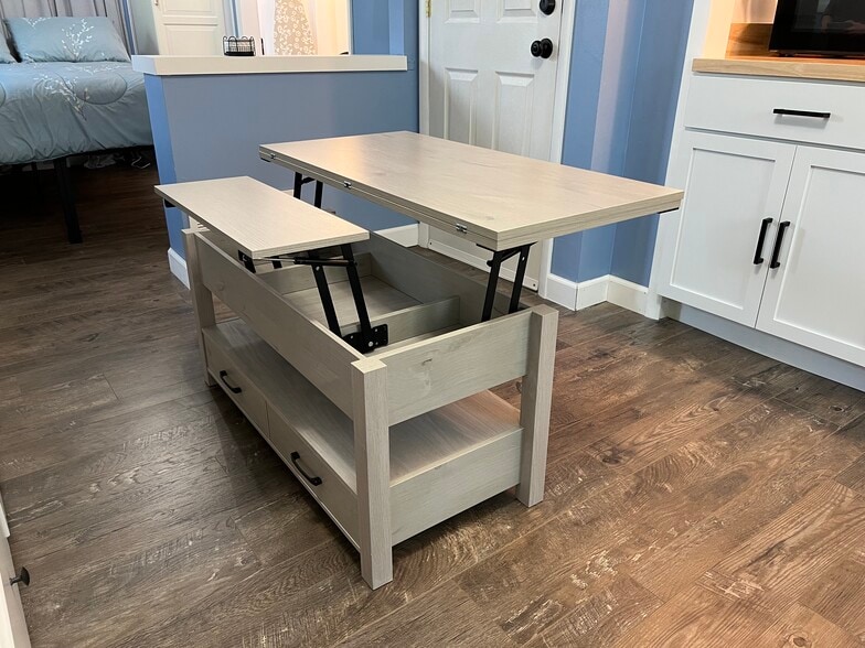 The coffee table has a built in computer desk if you prefer to work here instead of the desk. - 908 Lake Rd