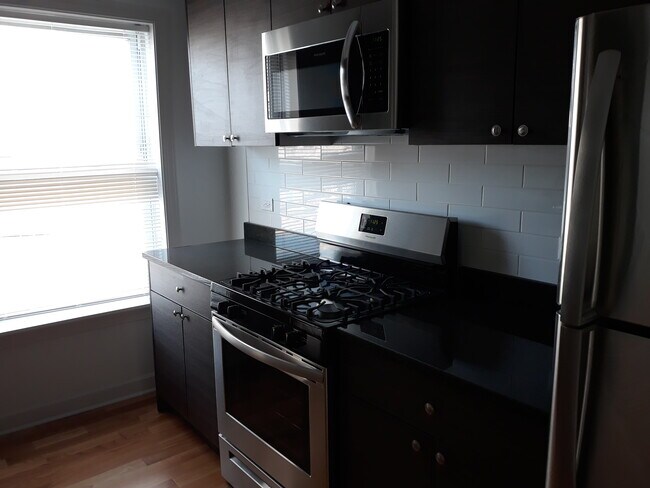 Building Photo - 1644 W Pratt Blvd