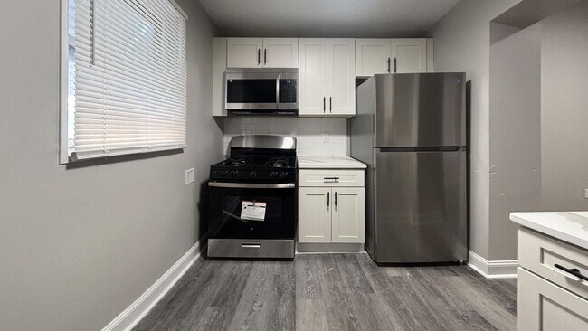 Building Photo - Bright 3BR with Sleek Vinyl Flooring & Modern Kitchen