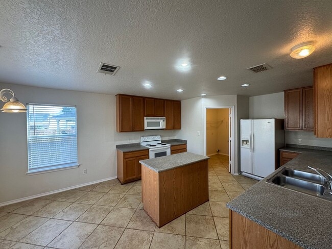 Building Photo - CUTE 2-STORY NESTLED ON A CUL-DE-SAC FEATURING AN ISLAND KITCHEN WITH STOVE/RANGE, DISHWASHER, MI...