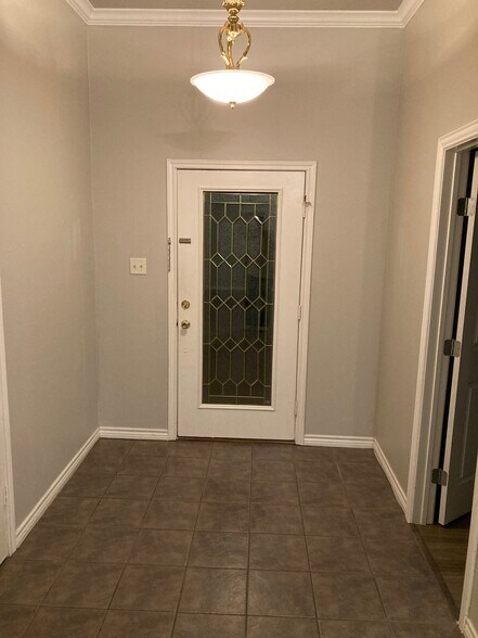 Foyer with coat closet and office. - 16485 County Road 164