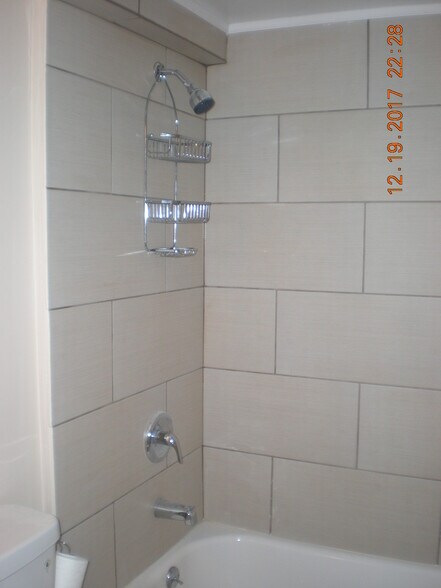 New tile around tub and on floor! - 1160 Clinton St