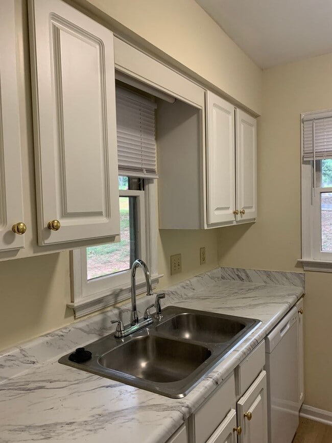 Building Photo - ONE LEVEL CONDO NEAR REX HOSPITAL -Firepla...