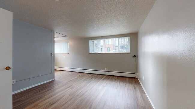 Explore the open space of this contemporary apartment, perfect for personalization. - Harmony Apartments