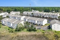 Building Photo - Welcome to Harbor Landing Condominiums — where coastal living meets convenience!