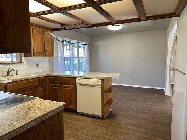 Building Photo - Clean, updated home on a corner lot with privacy fence and storage shed.