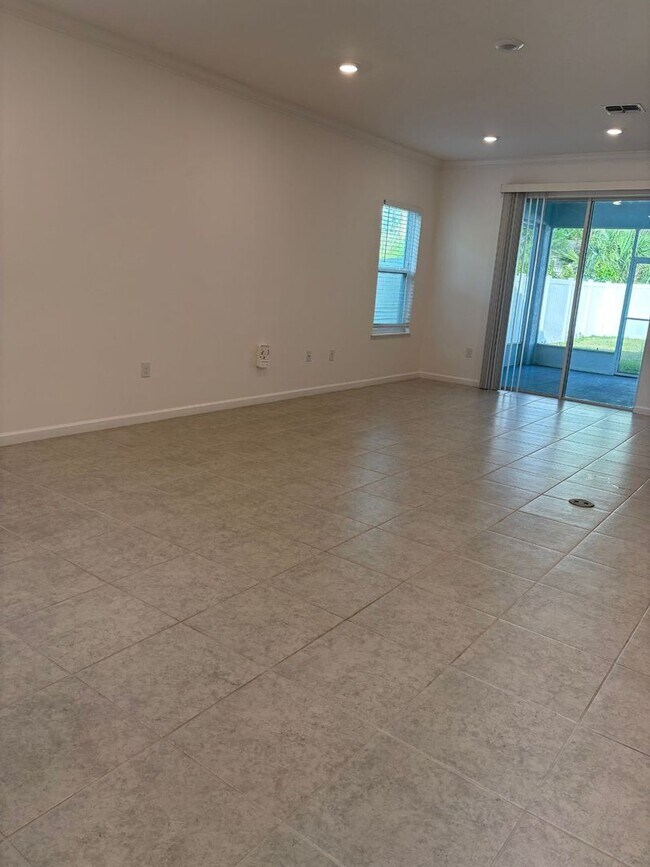 Building Photo - Like New 3 bedroom + den with French doors, screened in porch and Fenced yard and much more...