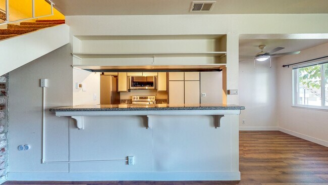 Building Photo - 2 story 2 bedroom 1 bath condo with covered parking, private storage and community pool!