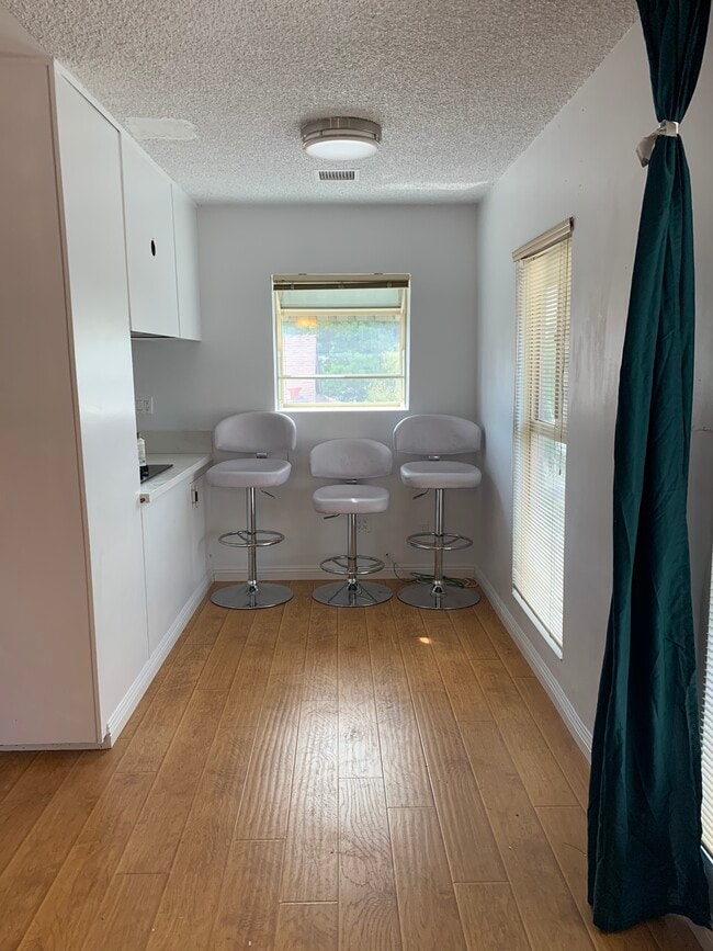 Dining area with furnished 3 barstools - 1914 W Alameda Ave