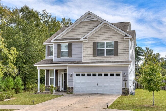 Building Photo - 4 bed, 2.5 bath home on corner lot with 2 car garage and fenced in back yard