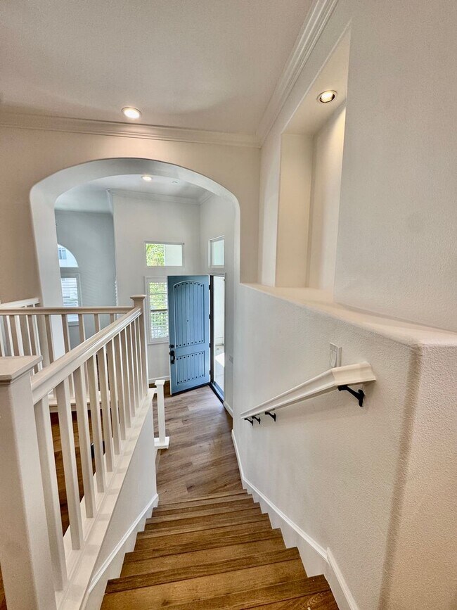 Building Photo - Beautifully Remodel Townhouse with AC & Two Car Garage!