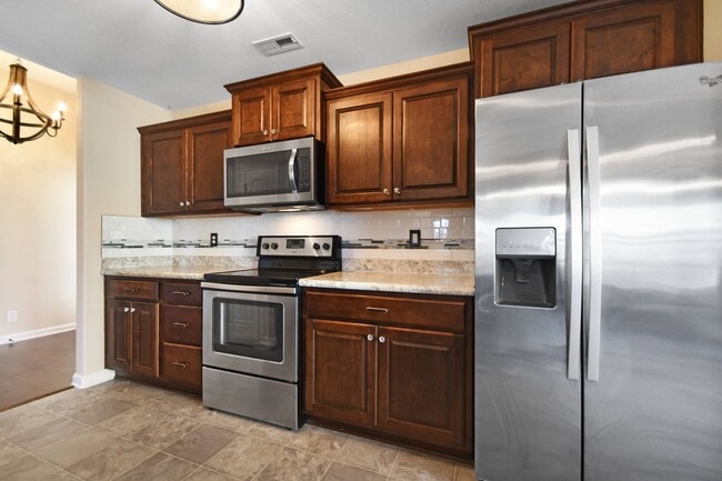 Building Photo - Pet Friendly Three Bedroom with Bonus!