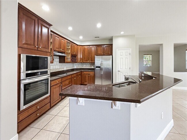 Building Photo - Waterfront 4 Bedroom Home in Eagle Creek Golf Community – Lake Nona