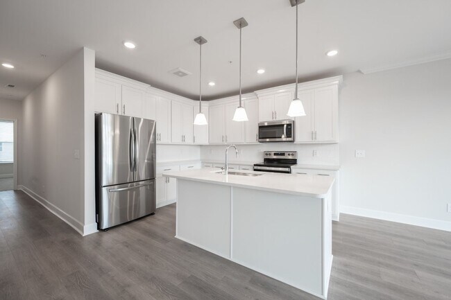 Building Photo - 2022-BUILT BURKITT COMMONS CONDO WALKABLE ...