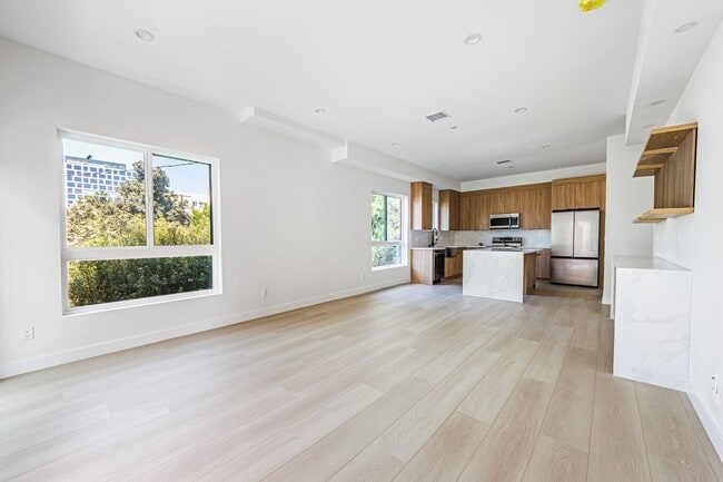 Building Photo - Modern 4-Bedroom Townhome-Style Living in ...