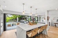 Building Photo - Designer 4BR Home with Pool and Indoor-Out...