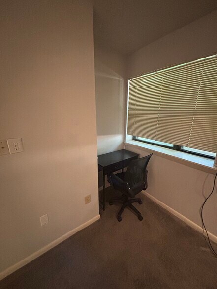Basement desk in living room - 596 Wild Flower Glade