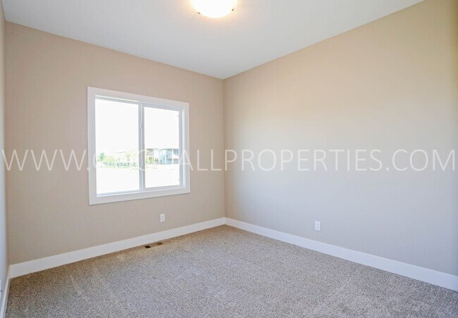 Building Photo - 4-Bedroom Ranch Home in Clive with Finished Basement & 3-Car Garage