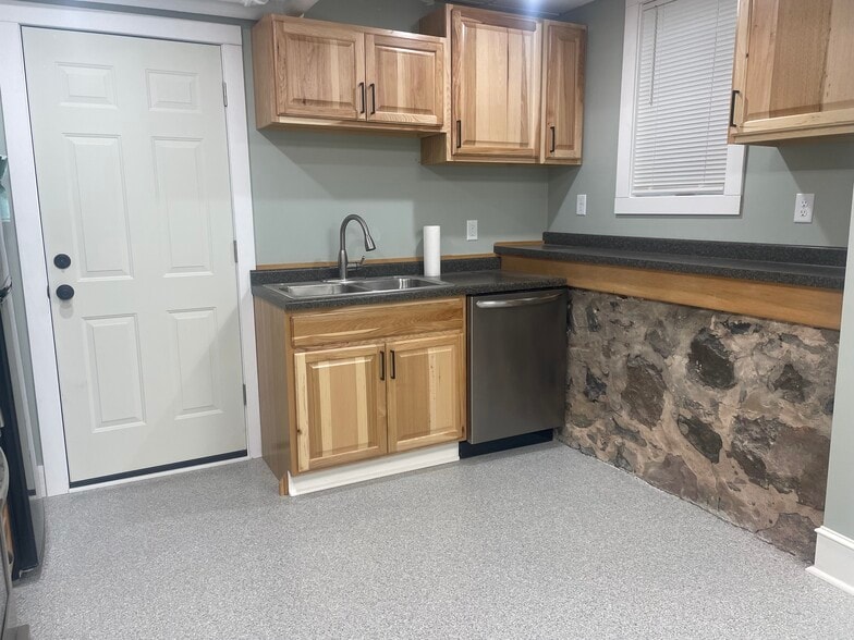 Kitchen and door to shared laundry. - 1826 E Superior St