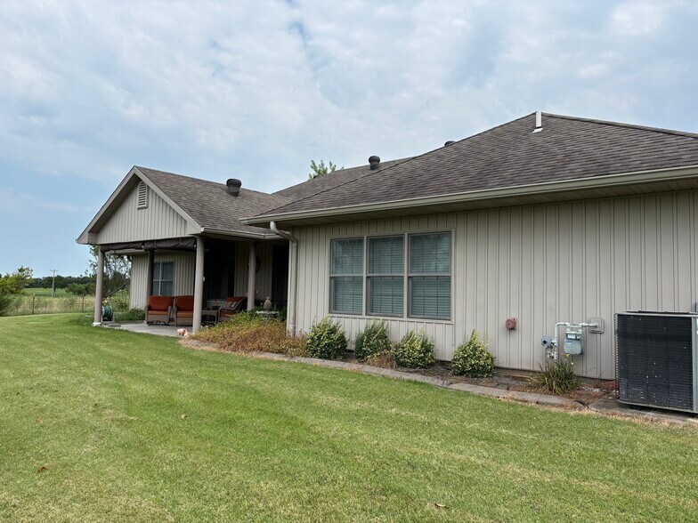Back of house facing field - 5225 E Dee Woods Rd