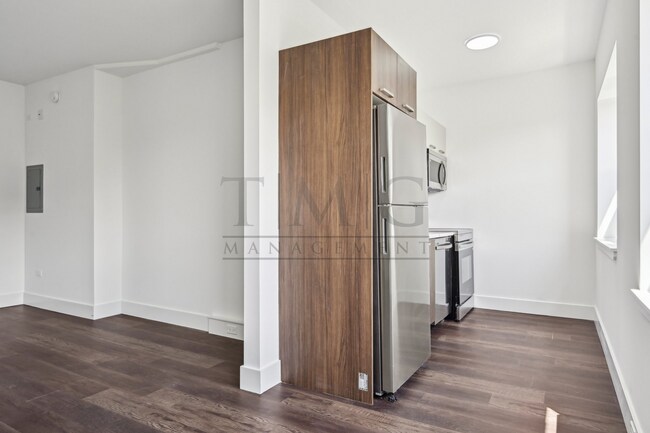 Building Photo - Sleek, Bright & Brand New — Stylish Studio...