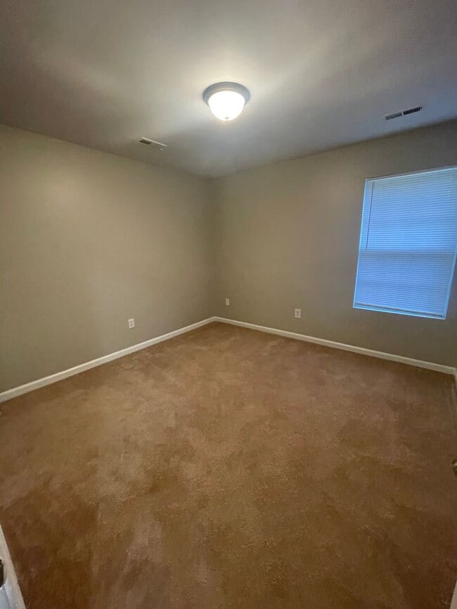 Building Photo - This two-story, 4-bedroom, 2-bath duplex in Fort Mill, SC sits on a corner lot