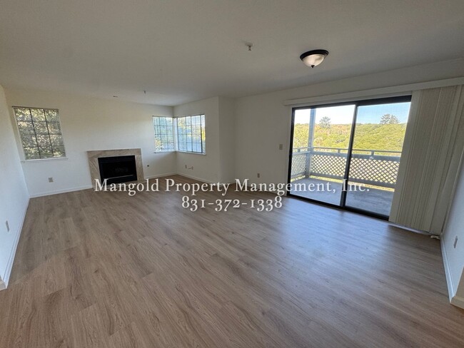 Building Photo - Spacious 2-Bed, 2-Bath Condo with Fireplac...