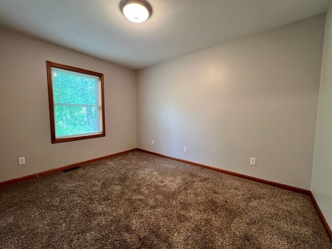 Building Photo - Spacious 3BR Duplex with Finished Basement & 2-Car Garage in Otsego