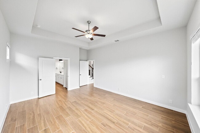 Building Photo - Greenbelt. 3 Car Garage. Built In Dog Room.