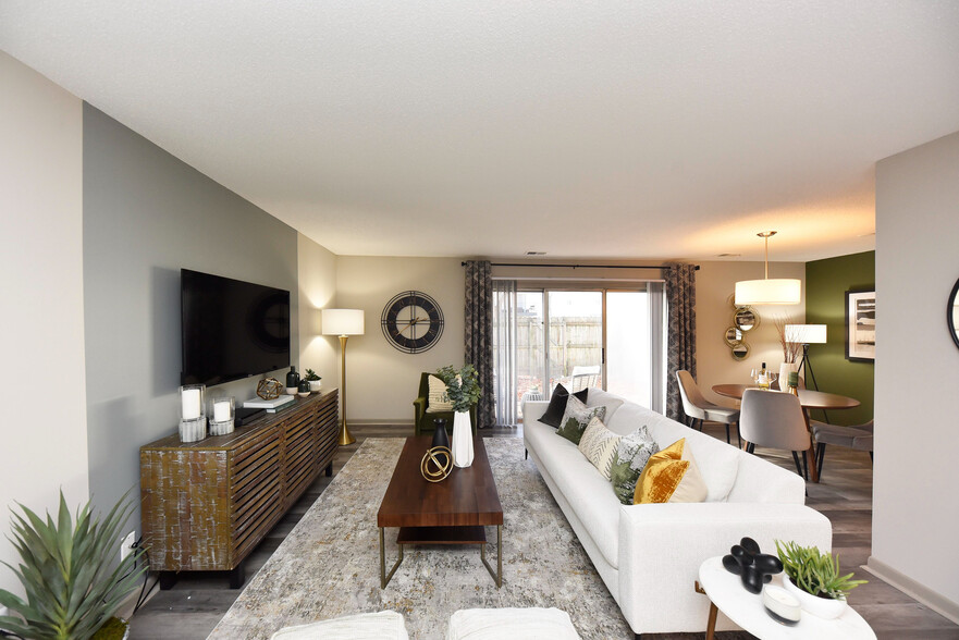 Step into this beautifully designed living space, where modern elegance meets cozy comfort. - Edison at Meridian Hills