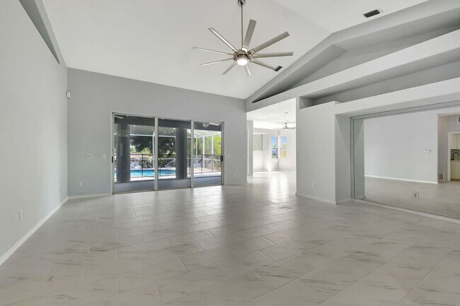 Building Photo - A BOATER'S PARADISE WITH THIS STUNNING 3 BEDROOM, 2 BATH WATERFRONT POOL HOME W/DOCK & BOAT LIFT ...