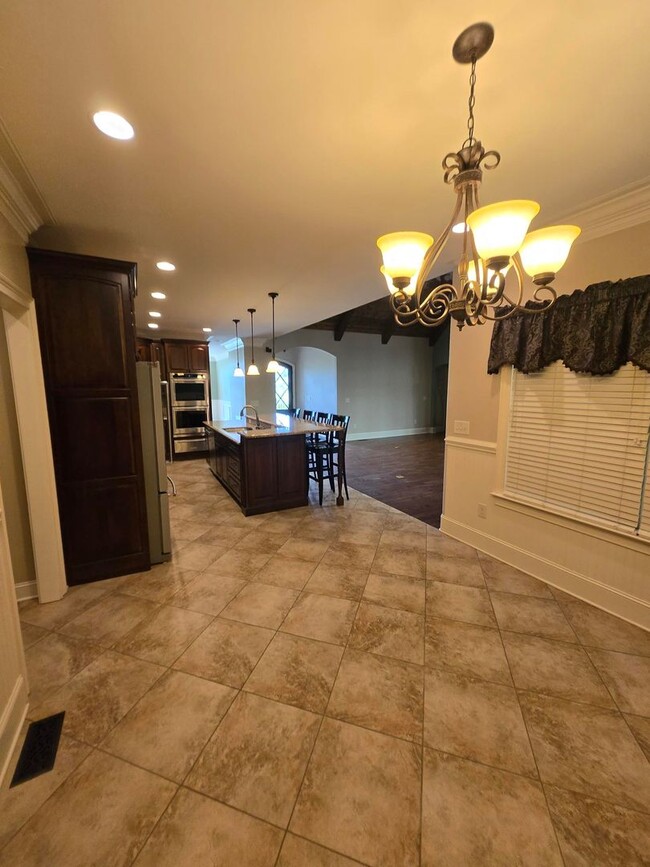 Building Photo - Luxury 4-Bedroom Home with Outdoor Oasis i...