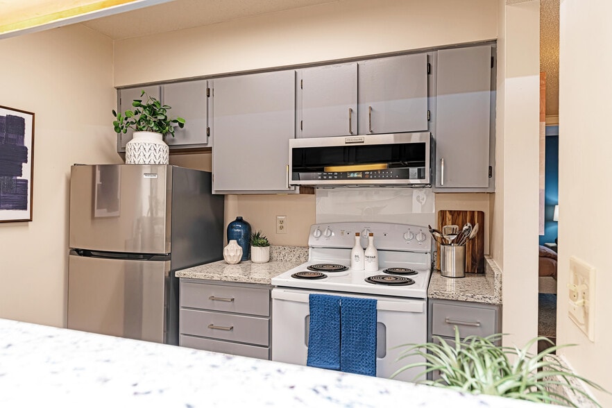 Kitchen with granite counters and modern cabinetry - The Manning