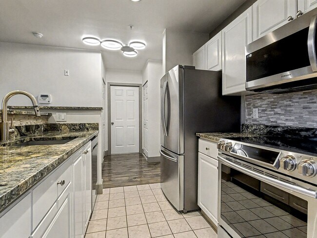 Building Photo - AVAILABLE NOW! Beautiful Queen Anne Condo with Puget Sound Views & Secure Parking!