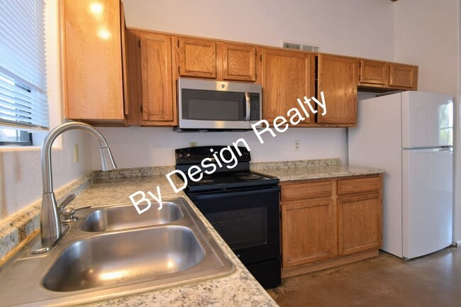 Building Photo - Charming Mid-Century Style: Vaulted Beams & Private Oversized Yard