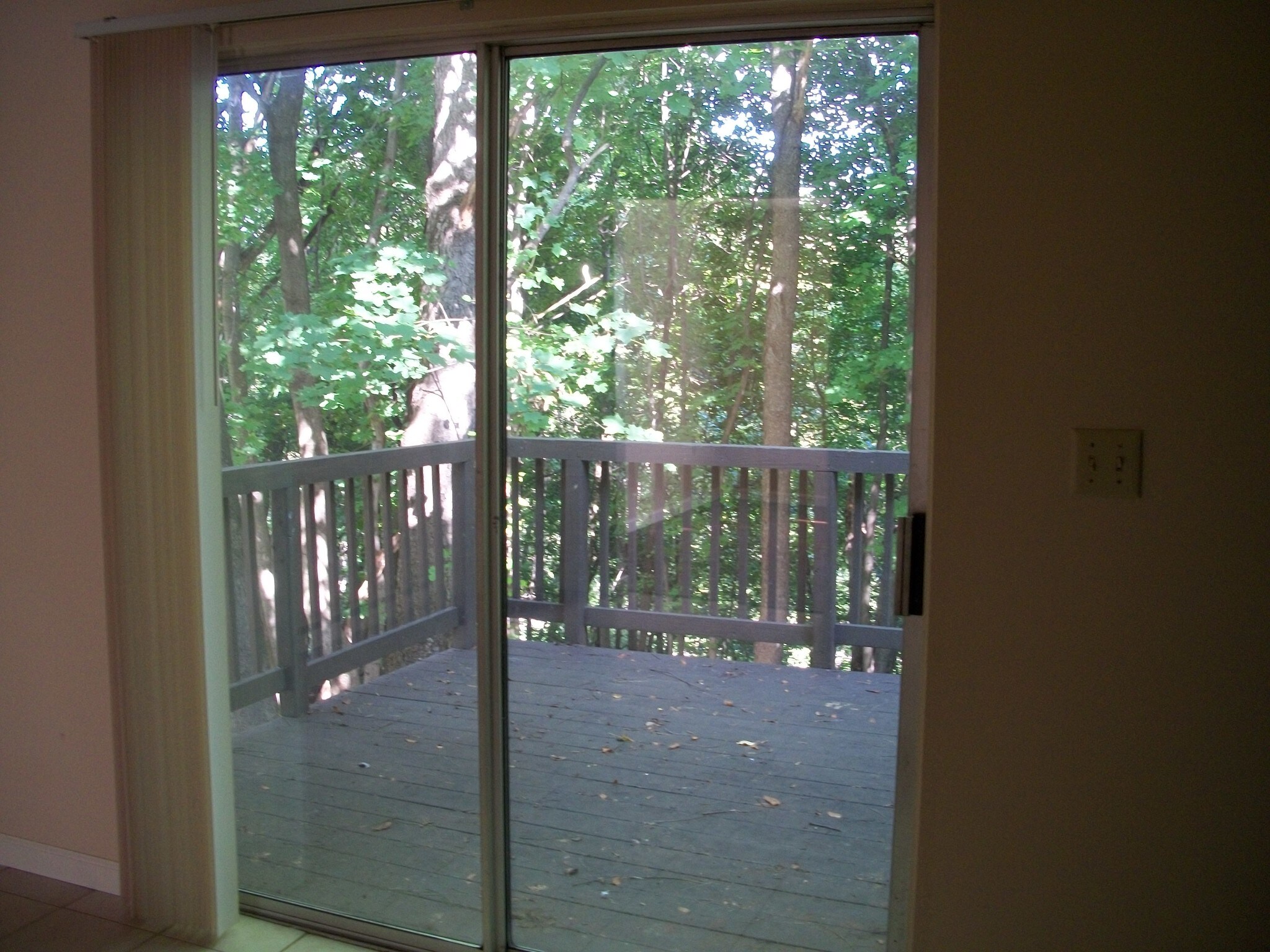 Step out onto the deck from the kitchen. - 206 Chateau Ln