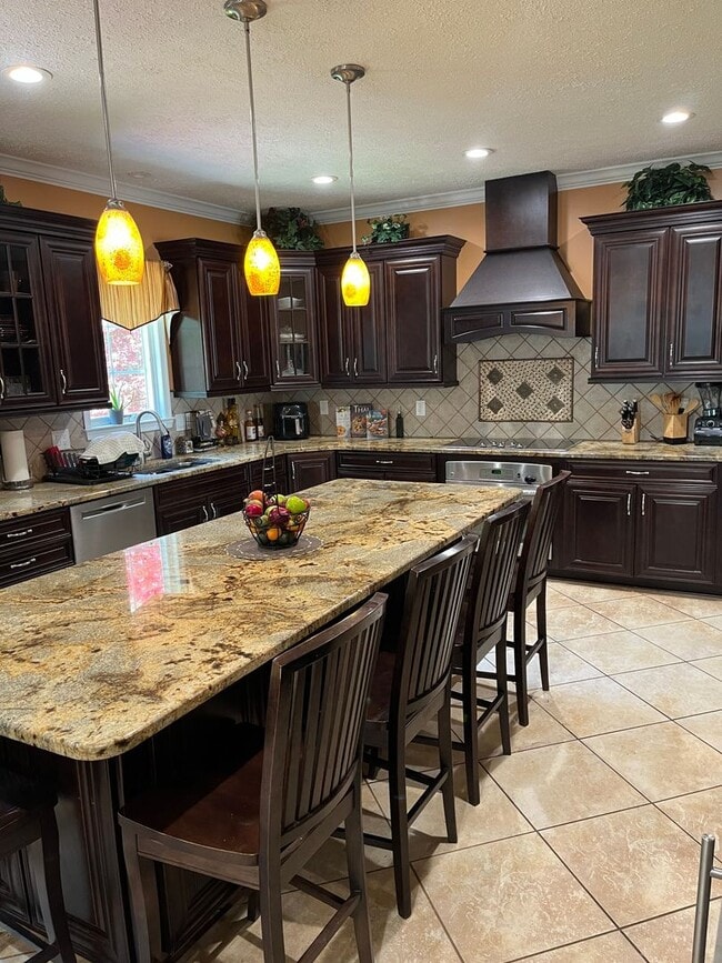 Building Photo - Updated & Landscaped 4 Bedroom, 4 Bath Hom...