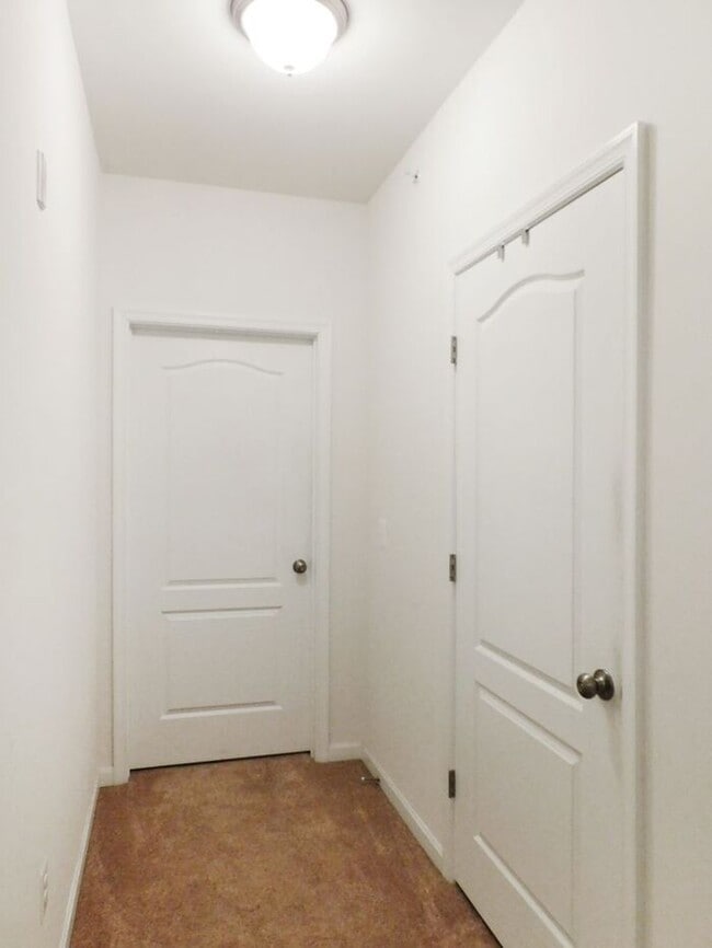 Building Photo - Pet Friendly Condo with Deck and 1 Car Garage
