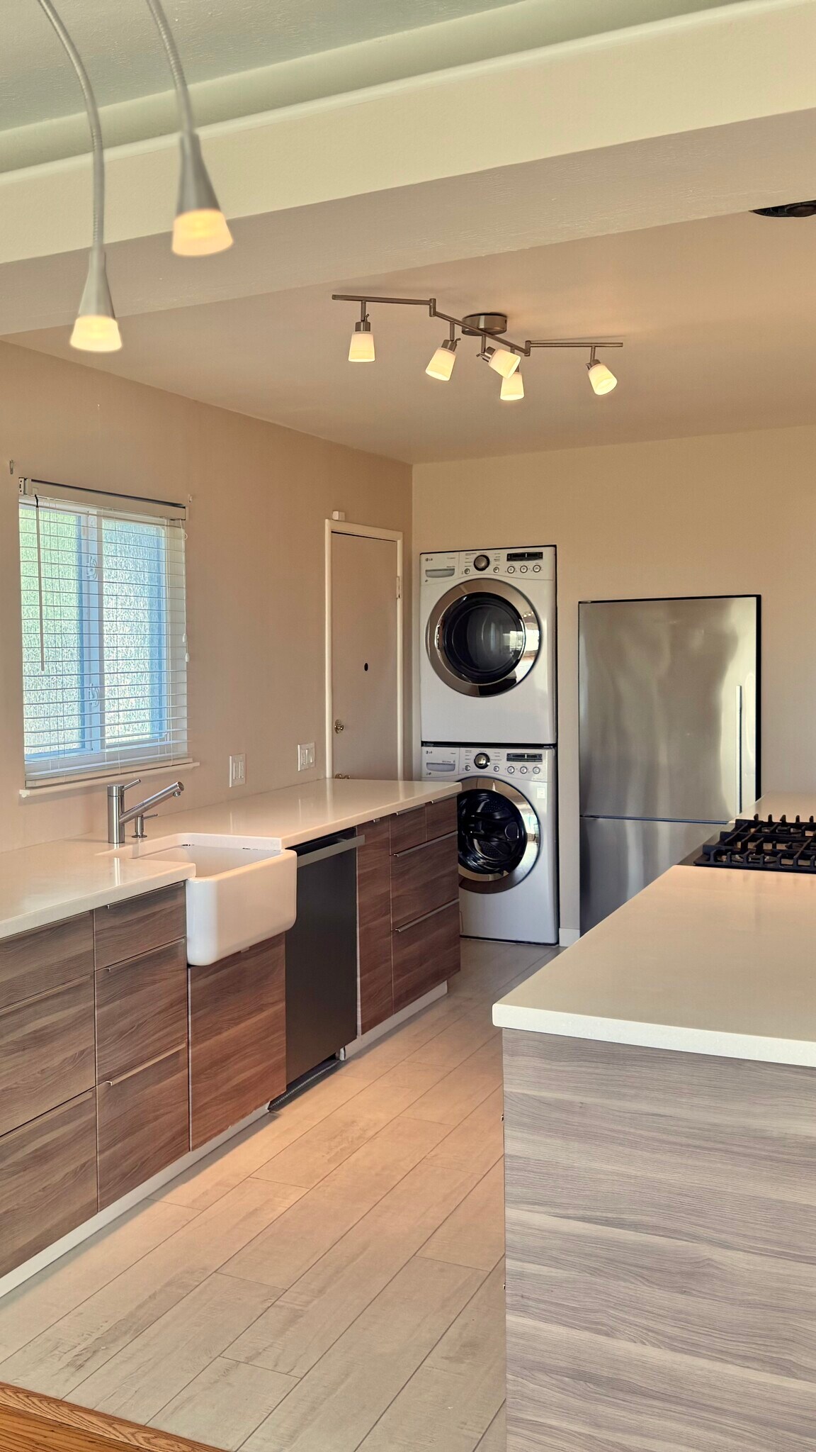 Amenities include a stacked, high-capacity LG front-loading washer and dryer and a stainless Fisher - 2403 Mira Vista Dr