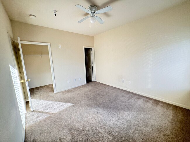 Building Photo - Home Near UNR: Spacious 4BR/4BA with Gated Access and Balcony!