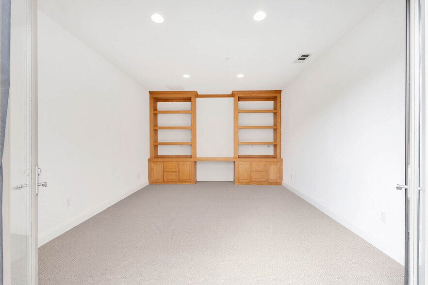 Downstairs Office With Built In Shelving & Cabinets - 12215 Delante Ct