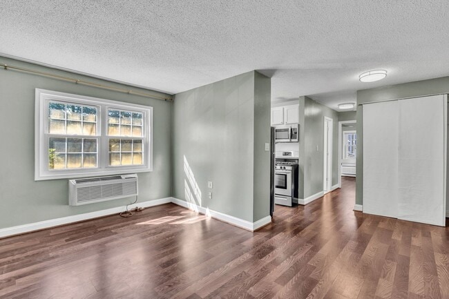 Building Photo - Utilities Included! Updated 2-Bedroom Condo Just Steps from Huntington Metro