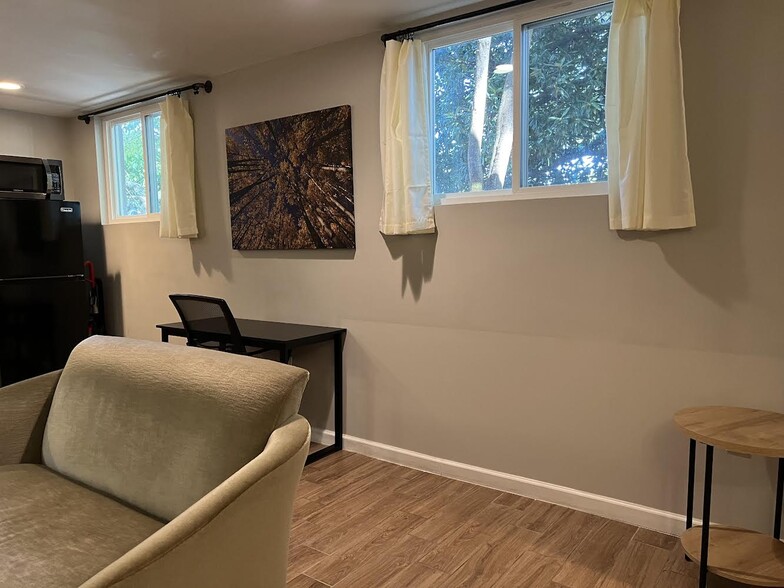 Workspace with ergonomic chair and surge protector - 3277 N Whitney Ave