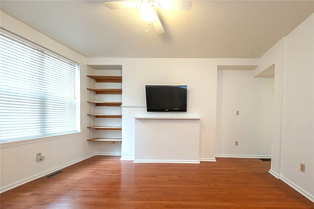 TV mounting rack for easy set up and built in shelves for lots of storage space - 114 Miltenberger St