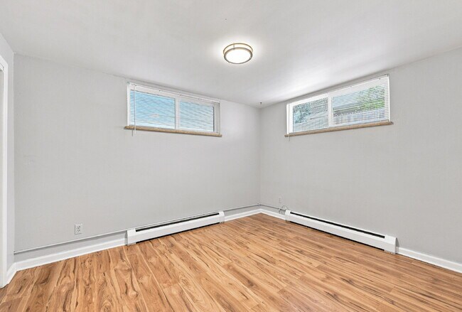 Building Photo - AVAILABLE NOW  Spacious 4-Bedroom Wheat Ridge Home with Finished Garden Level, Two-Car Garage & B...